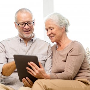 Couple Reading Hearing Resources on Tablet